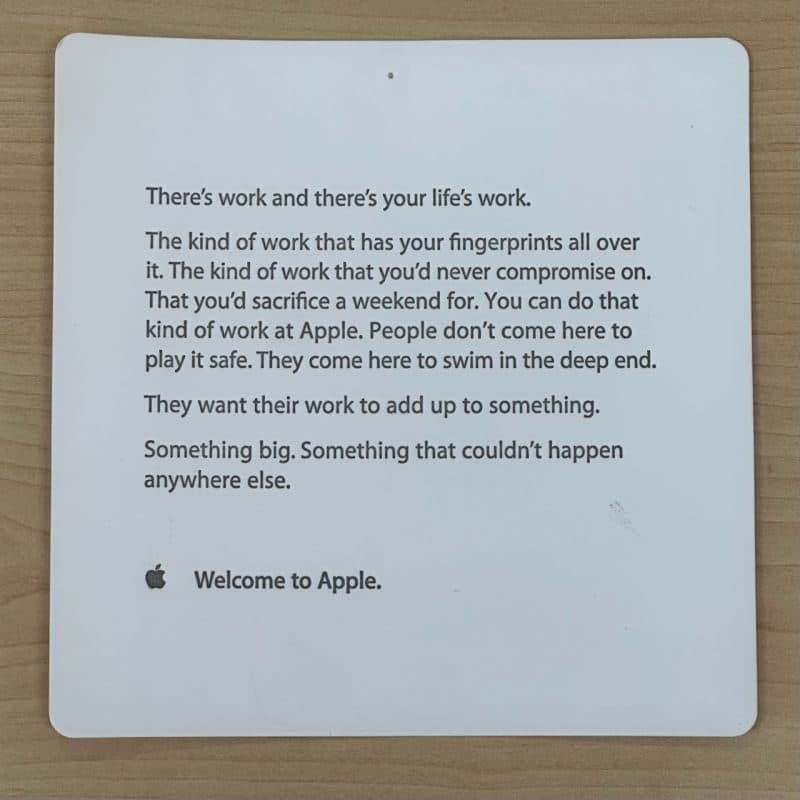 The Apple orientation placard: “There’s work and there’s your life’s work.”